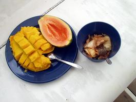 Typical island lunch of mango, papaya, and kimchee (kimchee???)