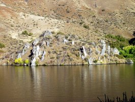 Unusual outcroppings reflect on the Oxbow Reservoir