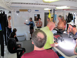 The all-important dive briefing--did he say the wall was on our left or right? (Photo by John Schwind)