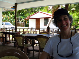 Lori at the Okemii Deli & Internet Cafe with our rental car in the background