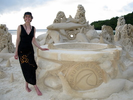 Lori in front of the sand sculpture