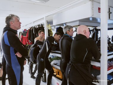 The divers pay rapt attention to the dive briefing