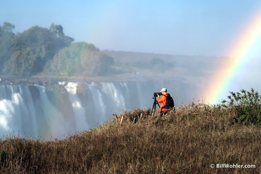 This photographer is unaware of the pot of gold just to his right