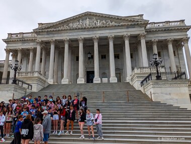 A large group of students in front of the east entrance to the Senate wing