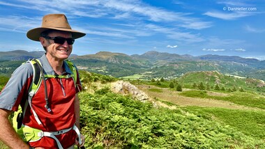 I'm looking good, but we haven't yet climbed that hill/mountain behind me (photo by Dan Heller)