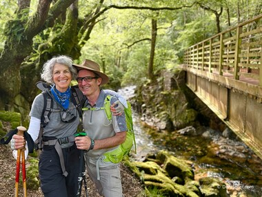 Lori and I pose in front of the river and bridge (photo by Dan Heller)