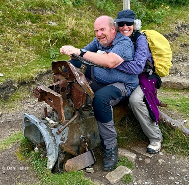 Tony and Lori have fun on the remnants of an old tractor