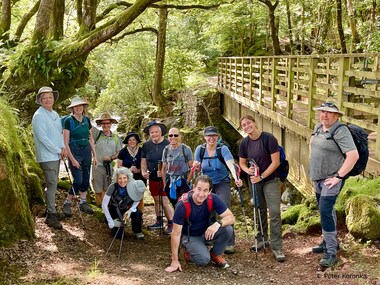 The group poses by a very scenic river (photo by Peter Koronka)