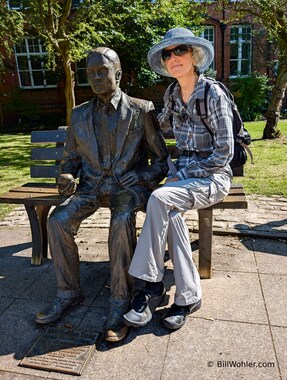 Lori poses with a sculpture of Alan Turing, who devised a machine to use the mathematics created by the Poles to break the German 'Enigma' code