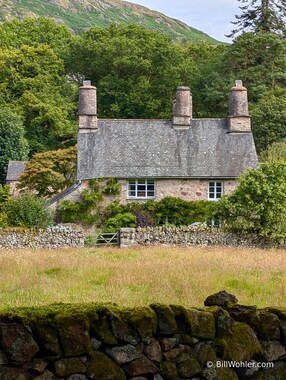 The two lines at the base of the chimneys indicate where the old thatched roofs would have been before they were replaced by a "modern" roof