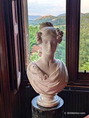 A bust of a former madame in front of the lovely view of the Lake District mountains