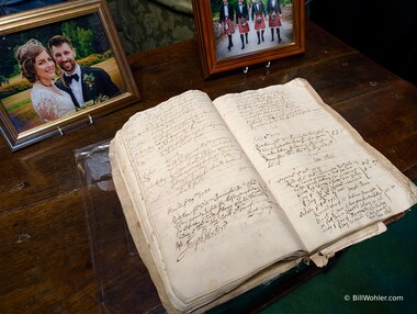 A couple of books, one handwritten, the other with a handwritten preamble, fin the library