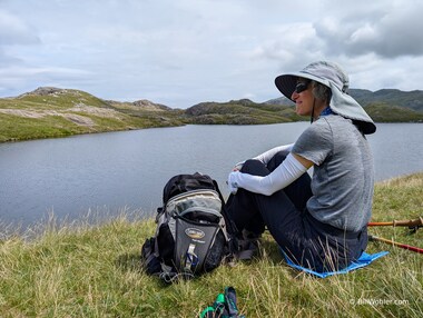 Lori takes a break just before lunch above the Sprinkling Tarn