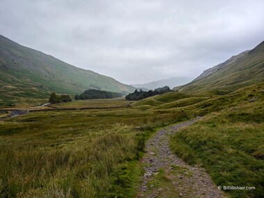 Lori hikes out of the misty valley