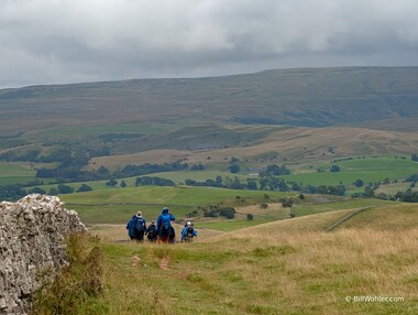 The troop marches on to the Nine Standards on the hill opposite