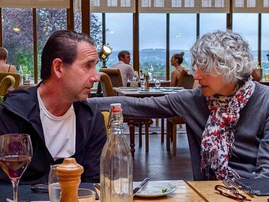 Lori and Michael in a deep conversation at dinner in the Appleby Manor Hotel