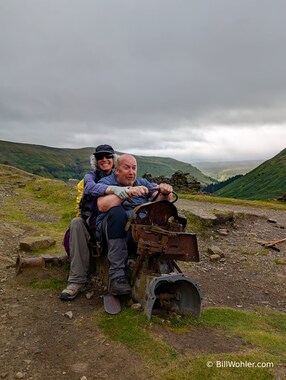 Tony and Lori have fun on the remnants of an old tractor