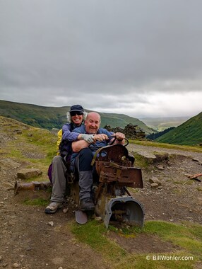 Tony and Lori have fun on the remnants of an old tractor