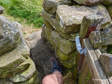 The stiles, narrow to prevent sheep from getting through, can still be challenging for humans