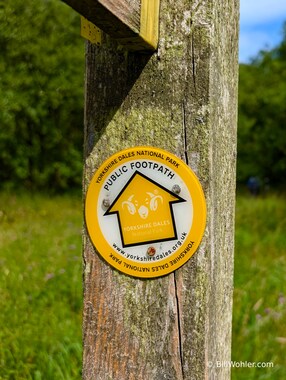 Note the logo within the directional arrow in the Yorkshire Dales National Park Public Footpath sign