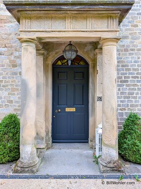 The entrance to Easby Hall is flanked with columns