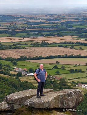 Tony stands proud upon the Wainstones as the threatening squall approaches quickly