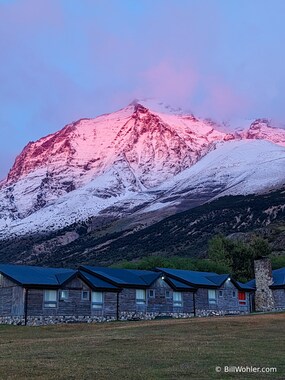 The sunrise colors the peaks behind the hotel beautifully