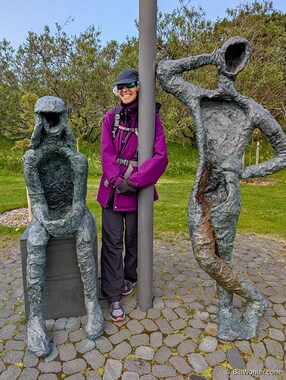 Lori poses with sculptures