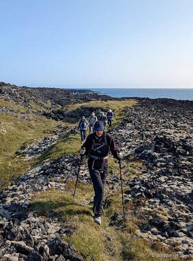 Lori leads the group across the lava fields