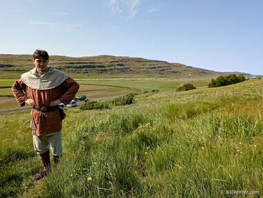 You have to look very, very carefully to see the stone ruins of Eir&iacute;kssta&eth;ir, the home of Erich the Red--the replica is in the background