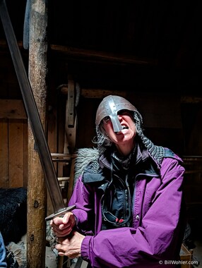 Lori demonstrates the use of the helmet, mail, and--uh--one-handed sword