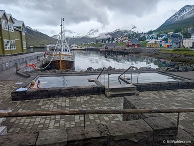 The hot tub at the Sigl&oacute; H&oacute;tel in Siglufj&ouml;r&eth;ur with a view of the harbor and town