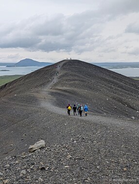 Our gang hikes along the rim of the Hverfjall Crater with views of Lake M&yacute;vatn