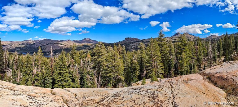 A panorama of the mountains to the east: Caples Lake, Red Lake Peak, Black Butte and Elephant's Back peaking behind it to its right, Round Top, The Sisters, and Fourth of July Peak
