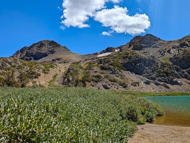 A view of Round Top) and The Sisters beyond Round Top Lake