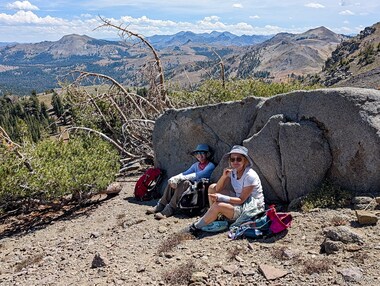 Lori and Vera take a lunch break against a cool rock