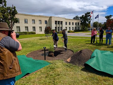 Eugene Tu leads the ceremonial planting of the Artemis Moon Tree
