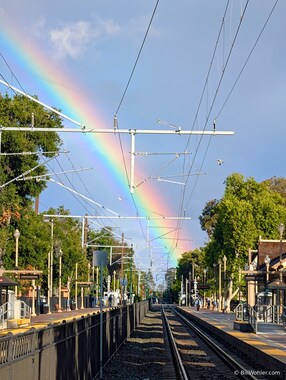 The obligatory rainbow photo; a vivid rainbow with an not-so-stellar angle of the Menlo Park Caltrain Station
