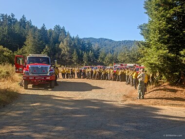 As we walked around the corner, we saw a phalanx of firefighters being briefed.