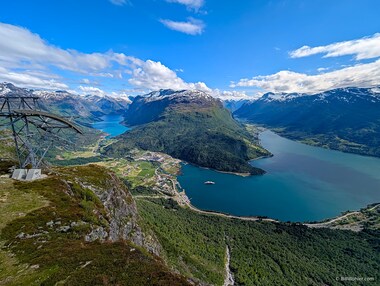 This wide angle shot captures the top of the tram, the Kjenndalsbreen above the Lovatnet, the village of Loen, the Innvikfjord, and the Jostedalsbreen above the Oldevatnet.